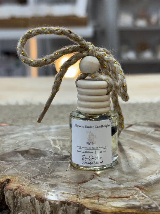 Car Diffuser by Flowers Under Candlelight